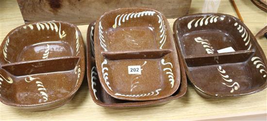 Four 19th century slipware baking dishes